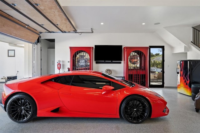 garage featuring refrigerator and recessed lighting