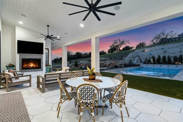 view of patio featuring an outdoor living space with a fireplace, an outdoor pool, outdoor dining area, and ceiling fan