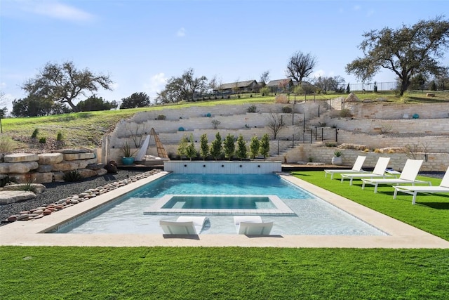 view of pool with a yard and an in ground hot tub