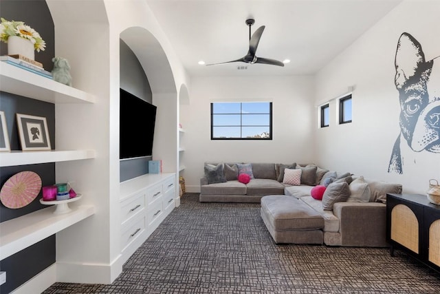 living area with ceiling fan, dark colored carpet, and recessed lighting
