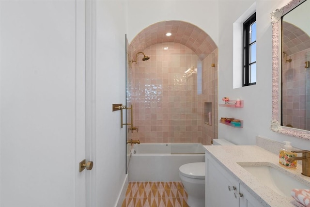 full bathroom featuring bathtub / shower combination, vanity, and toilet