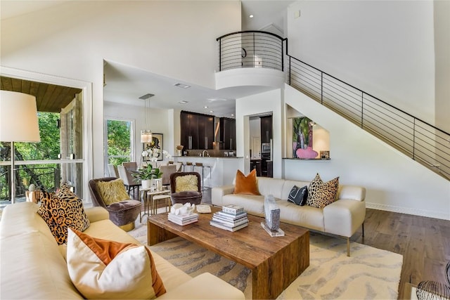 5802 Gentle Breeze Ter, Austin, TX 78731 - living room with wood finished floors and a high ceiling