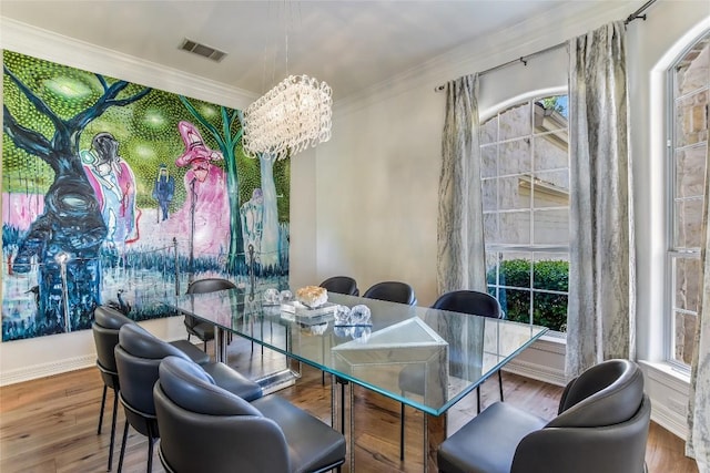 5802 Gentle Breeze Ter, Austin, TX 78731 - dining area with ornamental molding, a chandelier, and wood finished floors
