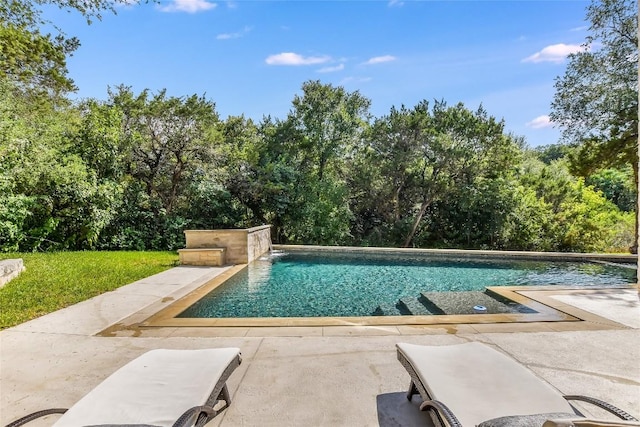5802 Gentle Breeze Ter, Austin, TX 78731 - swimming pool featuring a patio and view of wooded area