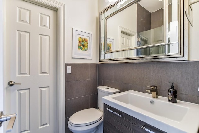 5802 Gentle Breeze Ter, Austin, TX 78731 - bathroom featuring tile walls, vanity, and a wainscoted wall