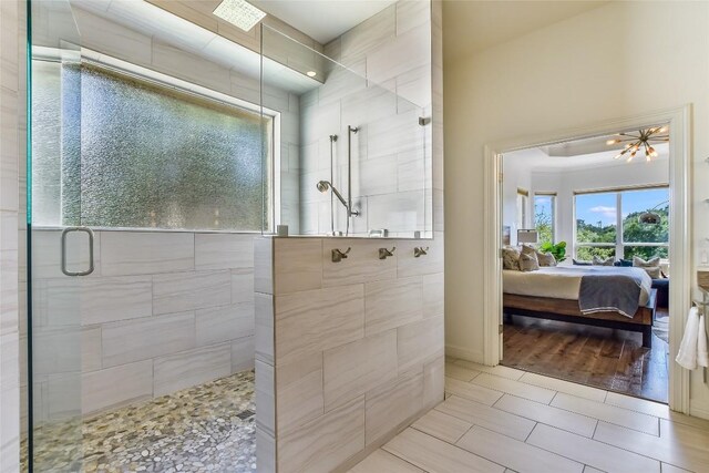 5802 Gentle Breeze Ter, Austin, TX 78731 - full bathroom featuring ensuite bath, a tile shower, and tile patterned floors