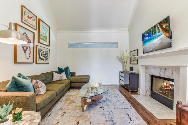 5802 Gentle Breeze Ter, Austin, TX 78731 - living room with ornamental molding, wood finished floors, a premium fireplace, and vaulted ceiling