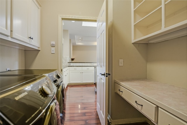 6407 Johanne Ct, Austin, TX 78750 - washroom featuring washing machine and dryer, dark wood-type flooring, and cabinet space