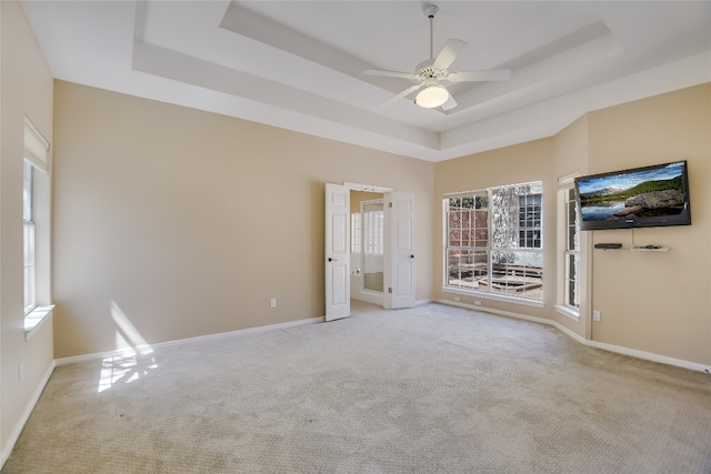6407 Johanne Ct, Austin, TX 78750 - carpeted empty room featuring a raised ceiling and ceiling fan