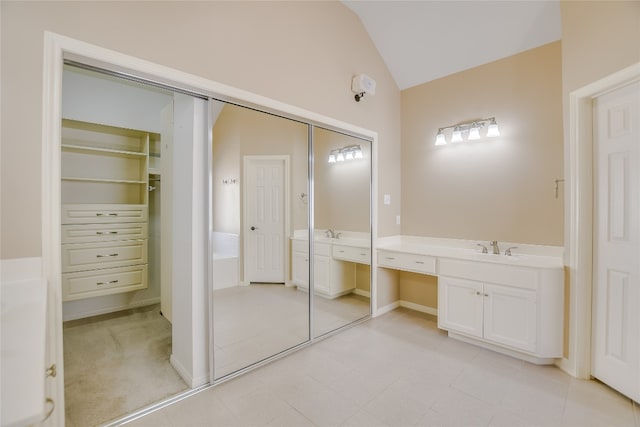 6407 Johanne Ct, Austin, TX 78750 - full bathroom with vanity, lofted ceiling, a tub to relax in, and a walk in closet