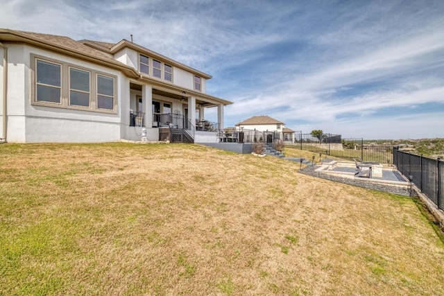 1304 Positano Pass, Leander, TX 78641 - rear view of property with covered porch and stucco siding
