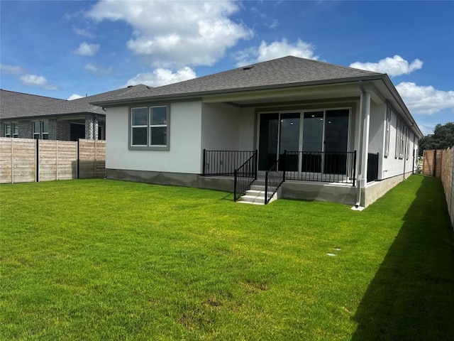 513 Raleigh Dr, Georgetown, TX 78633 - back of property featuring stucco siding, a fenced backyard, a shingled roof, and covered porch