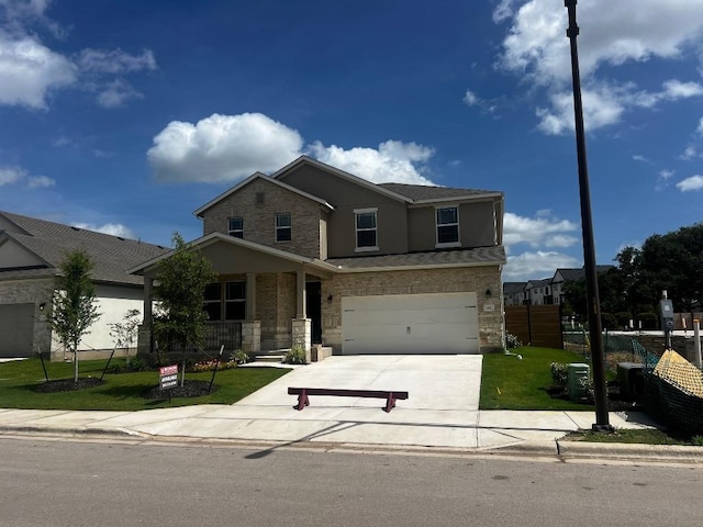 512 Raleigh Dr, Georgetown, TX 78633 - traditional-style home with driveway, stone siding, and an attached garage