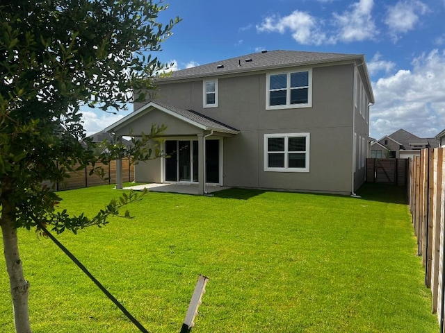 512 Raleigh Dr, Georgetown, TX 78633 - back of house with a fenced backyard, a patio, and stucco siding
