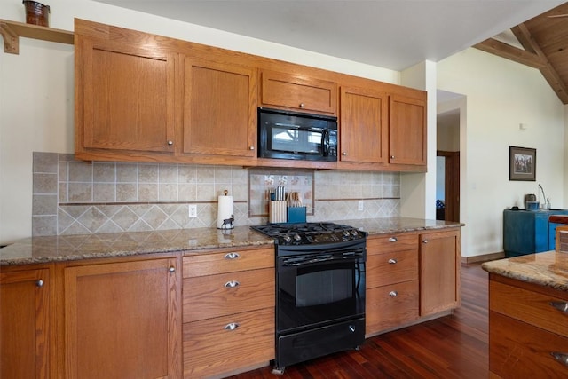 650 Farris Ranch Rd, Georgetown, TX 78633 - kitchen featuring black appliances, dark wood-style flooring, brown cabinetry, lofted ceiling, and light stone counters
