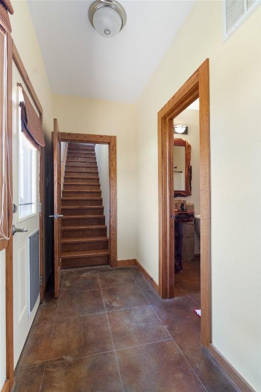 650 Farris Ranch Rd, Georgetown, TX 78633 - hallway featuring stairway, baseboards, and dark tile patterned flooring