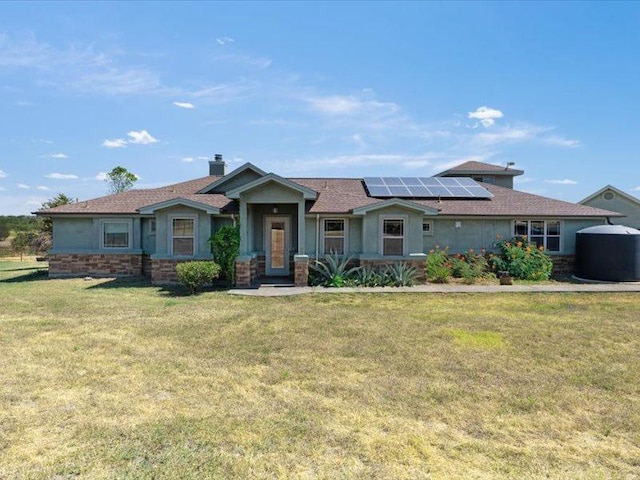 650 Farris Ranch Rd, Georgetown, TX 78633 - view of front of property featuring solar panels, a front yard, a chimney, and stucco siding