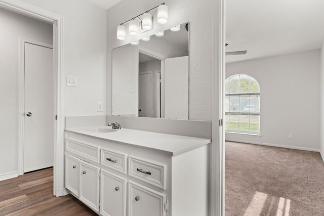 bathroom with baseboards and vanity