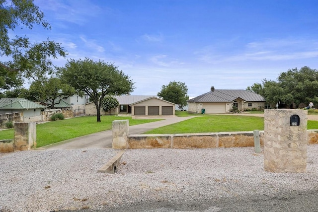 209 Senisa Dr, Buchanan Dam, TX 78609 - single story home with an outbuilding, fence, metal roof, and a front yard