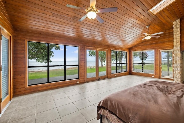 209 Senisa Dr, Buchanan Dam, TX 78609 - unfurnished bedroom featuring light tile patterned flooring, wooden ceiling, lofted ceiling with skylight, and wooden walls