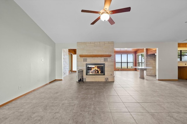 209 Senisa Dr, Buchanan Dam, TX 78609 - unfurnished living room with baseboards, a fireplace, light tile patterned floors, and a ceiling fan