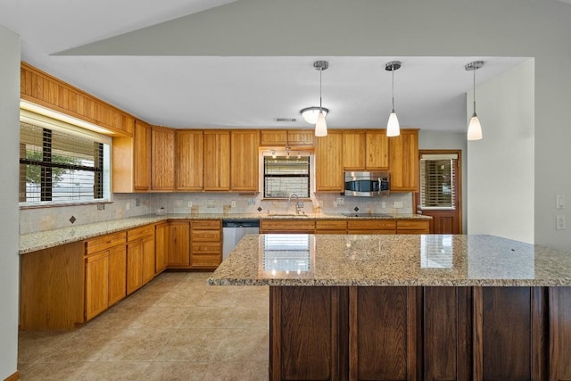 209 Senisa Dr, Buchanan Dam, TX 78609 - kitchen featuring a sink, light stone countertops, decorative backsplash, and appliances with stainless steel finishes