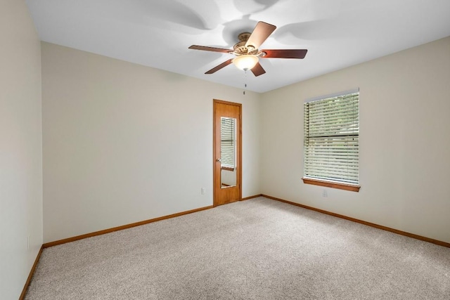 209 Senisa Dr, Buchanan Dam, TX 78609 - spare room featuring baseboards, light colored carpet, and ceiling fan