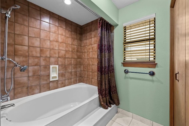 209 Senisa Dr, Buchanan Dam, TX 78609 - full bathroom with tile patterned floors, baseboards, and shower / bath combo with shower curtain