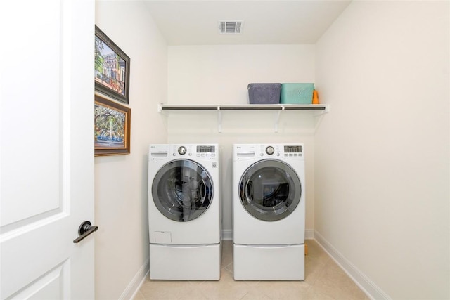 5314 Tribolo Trl, Round Rock, TX 78665 - laundry room featuring separate washer and dryer and light tile patterned floors