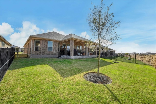 5314 Tribolo Trl, Round Rock, TX 78665 - rear view of property featuring brick siding, a fenced backyard, and a patio