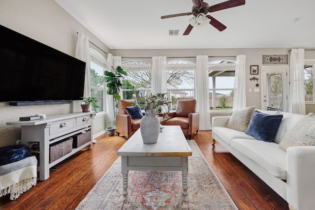 105 Wimberley St, Hutto, TX 78634 - living room with healthy amount of natural light, hardwood / wood-style floors, and a ceiling fan