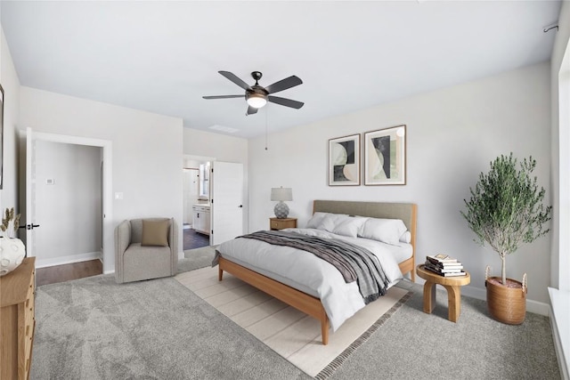 1017 Dog Iron St, Georgetown, TX 78633 - carpeted bedroom featuring a ceiling fan and ensuite bath