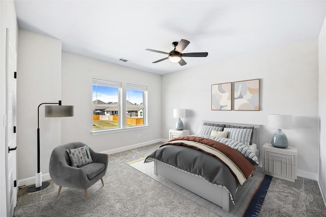 1017 Dog Iron St, Georgetown, TX 78633 - carpeted bedroom with baseboards and ceiling fan