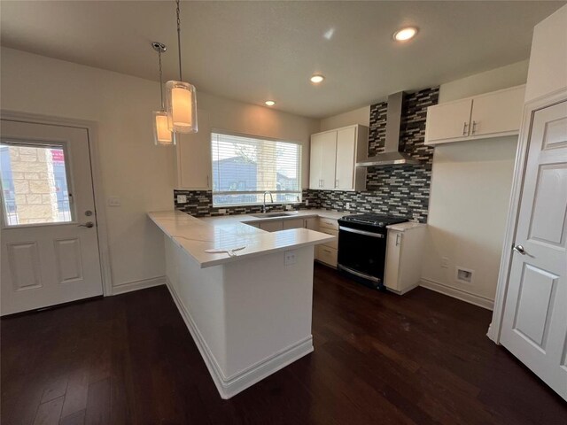 2105 Tiger Trl Unit 501, Round Rock, TX 78665 - kitchen with gas range, backsplash, a sink, wall chimney range hood, and a peninsula