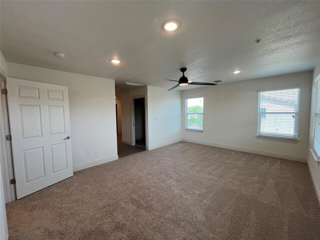 2105 Tiger Trl Unit 501, Round Rock, TX 78665 - spare room with carpet, a ceiling fan, attic access, baseboards, and recessed lighting