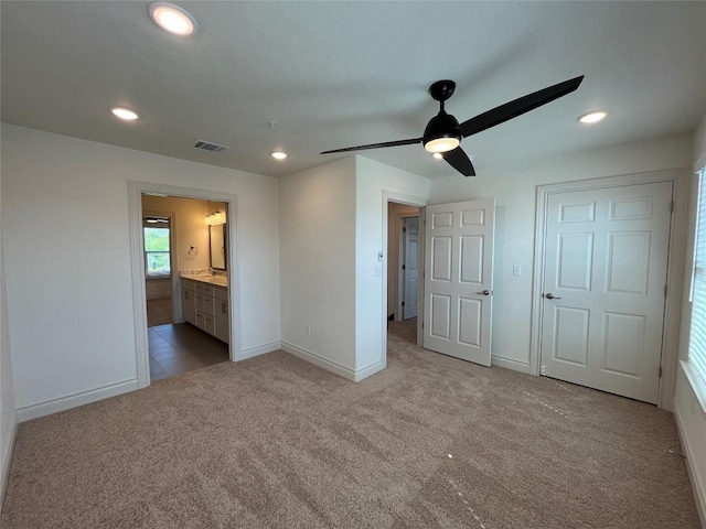 2105 Tiger Trl Unit 501, Round Rock, TX 78665 - unfurnished bedroom with visible vents, carpet, baseboards, connected bathroom, and recessed lighting