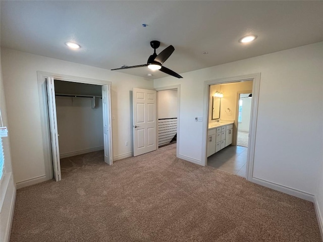 2105 Tiger Trl Unit 501, Round Rock, TX 78665 - unfurnished bedroom featuring recessed lighting, baseboards, a ceiling fan, light carpet, and a closet