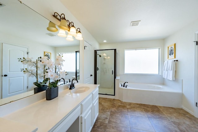 7724 Yaupon Dr, Austin, TX 78759 - bathroom with a garden tub, vanity, and a stall shower