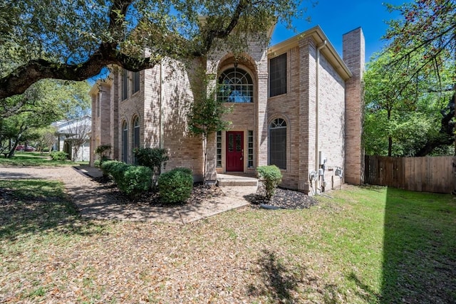 7724 Yaupon Dr, Austin, TX 78759 - view of front of house featuring brick siding and a chimney