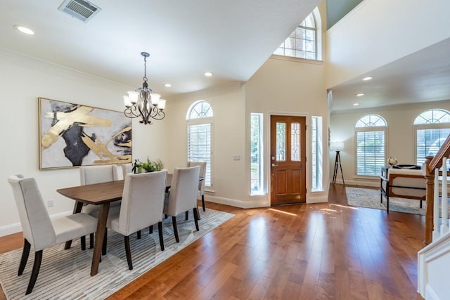 7724 Yaupon Dr, Austin, TX 78759 - dining room featuring a chandelier, plenty of natural light, wood finished floors, baseboards, and recessed lighting