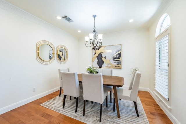 7724 Yaupon Dr, Austin, TX 78759 - dining space with a chandelier, ornamental molding, wood finished floors, healthy amount of natural light, and recessed lighting