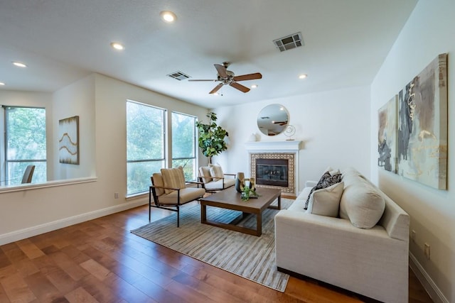 7724 Yaupon Dr, Austin, TX 78759 - living area with wood finished floors, a fireplace, ceiling fan, and recessed lighting