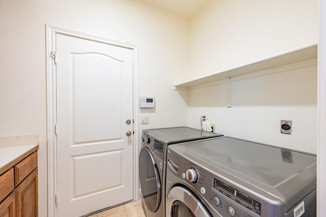 7724 Yaupon Dr, Austin, TX 78759 - laundry room with independent washer and dryer and light tile patterned floors