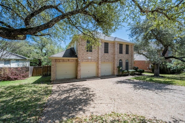 7724 Yaupon Dr, Austin, TX 78759 - view of front of home with brick siding, a garage, and driveway