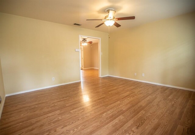 2312 Devonshire Dr, Austin, TX 78723 - unfurnished room featuring a ceiling fan and wood finished floors