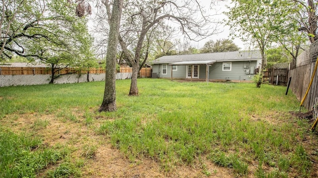 2312 Devonshire Dr, Austin, TX 78723 - fenced backyard with french doors