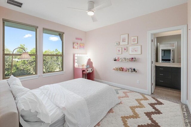 6109 Destination Way, Lago Vista, TX 78645 - bedroom with ensuite bath and ceiling fan