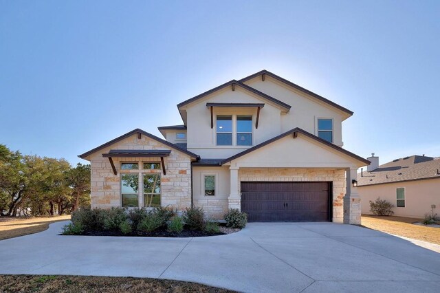 6109 Destination Way, Lago Vista, TX 78645 - view of front of house with stone siding, driveway, an attached garage, and stucco siding