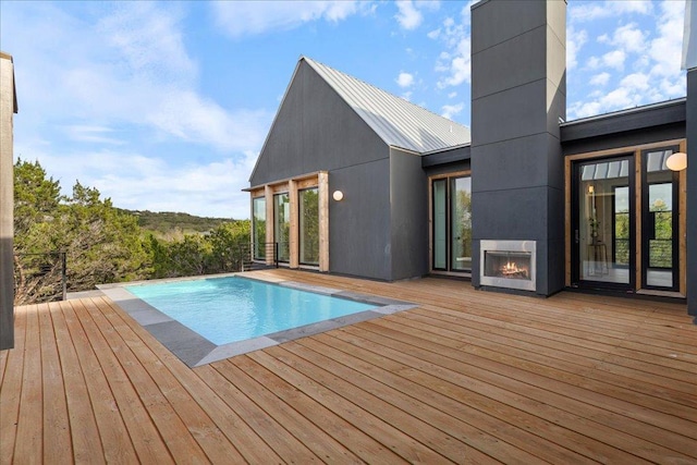 13400 Paisano Trl, Austin, TX 78737 - outdoor pool featuring a deck and a fireplace