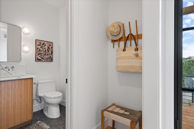 13400 Paisano Trl, Austin, TX 78737 - half bathroom with toilet, vanity, and baseboards